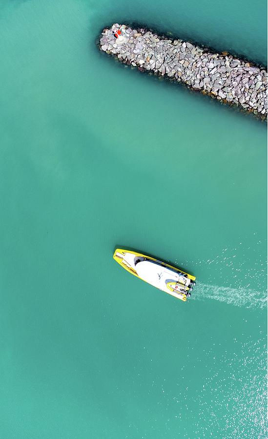 A boat heading out of harbour in Whitsundays, Australia Photograph by Andre Petrov