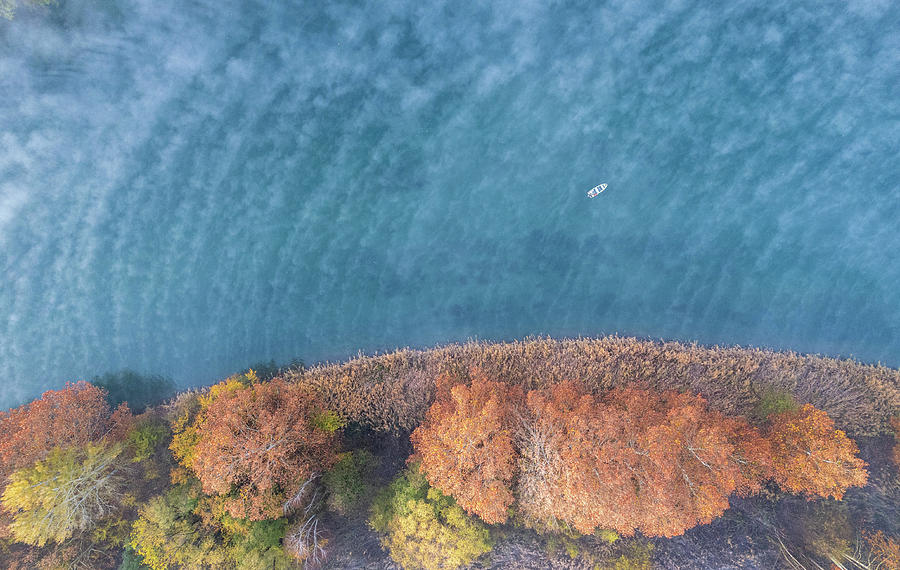 A boat in the river from drone Photograph by Pietro Ebner
