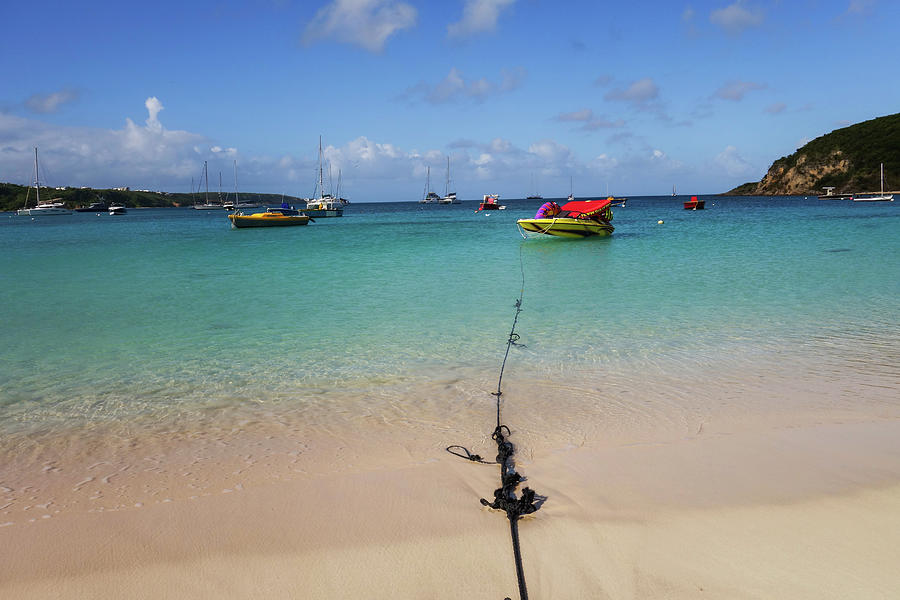 A boat on a rope in Aguilla at Sandy Point in the Caribbean Photograph by Toby McGuire