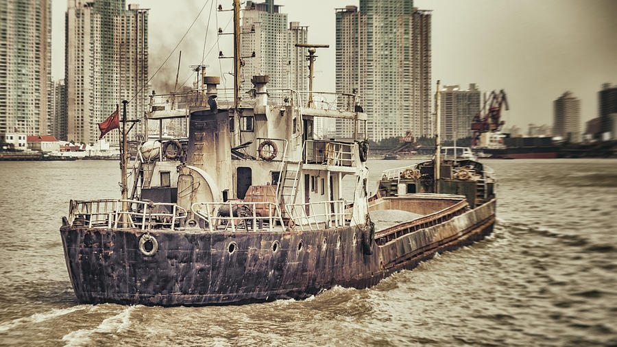 A boat on the Huangpu Photograph by Jakob Montrasio