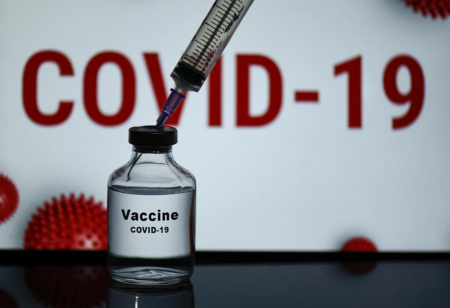 A bottle of  Covid-19 Vaccine Photograph by David Talukdar