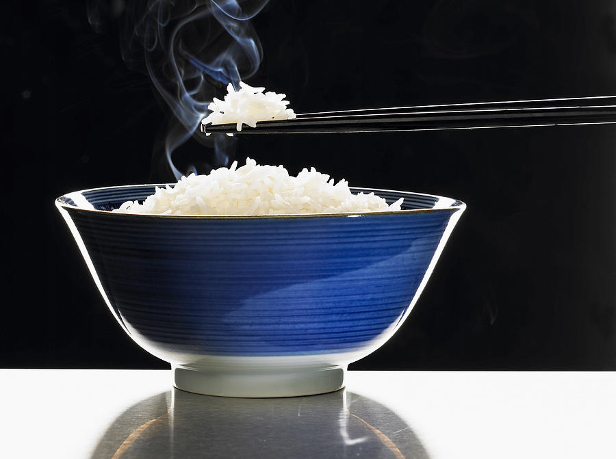 A bowl of steaming rice Photograph by Foodcollection RF