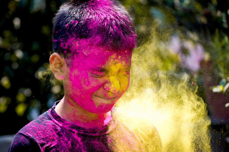 A boy with splashes of colour at holi festival Photograph by Subir Basak