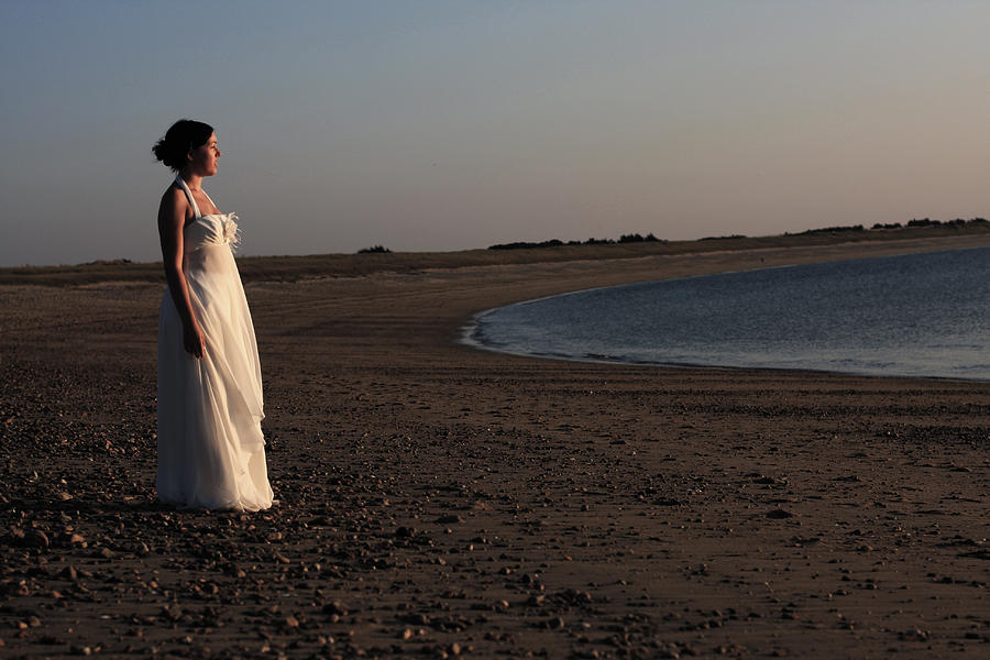 A bride on the beach Photograph by by Ludovic Toinel