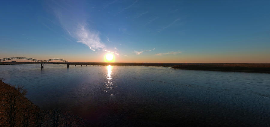 A Bridge and A Sunset Over the Mississippi River Photograph by Marcus Jones