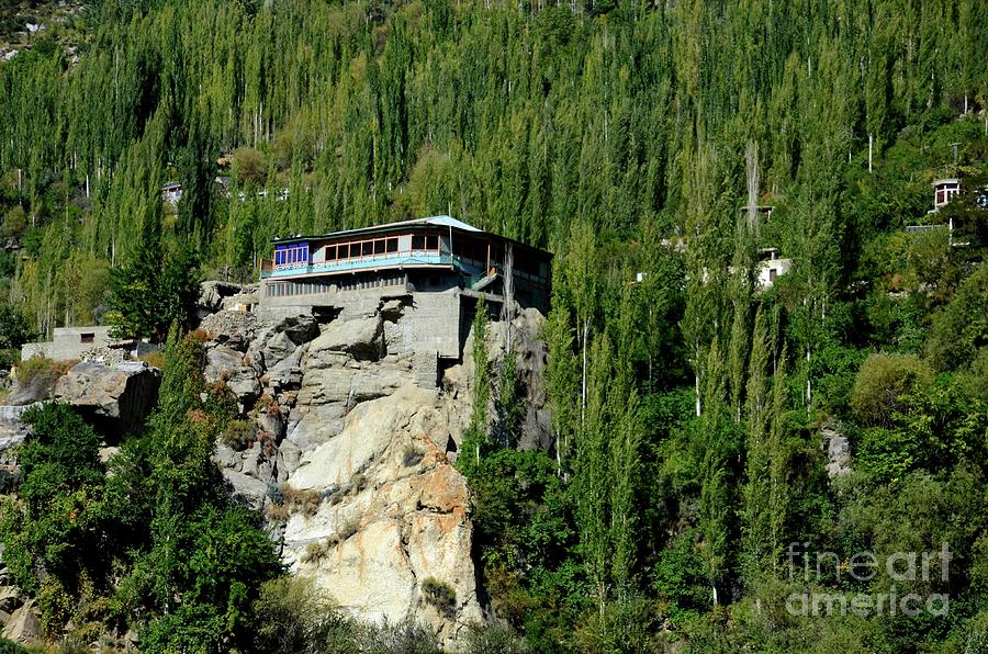 A Building Stands On Top Of A Rocky Ledge In Hunza Valley Pakistan Photograph
