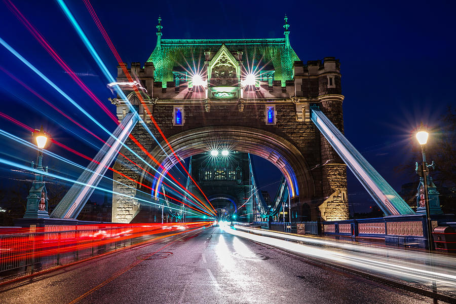 A Bus Passing On Tower Bridge In London. Photograph