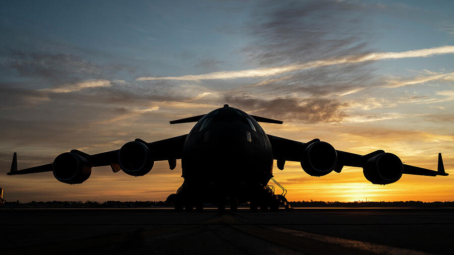 A C-17 Globemaster III rests on the flightline Photograph by Lawrence Christopher