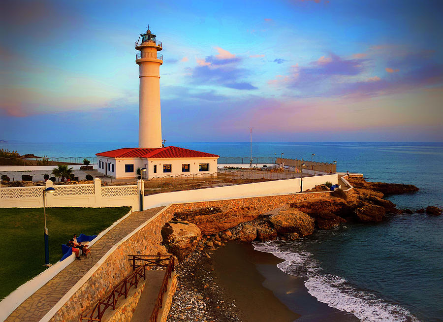 A calm evening at the lighthouse in Avenida del Faro, Torrox Costa, Costa Del Sol, Andalucia, Spain Photograph by Panoramic Images