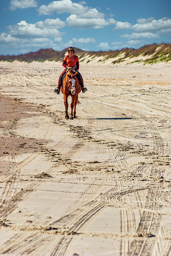 A Casual Ride on the Beach Photograph by Dan Carmichael