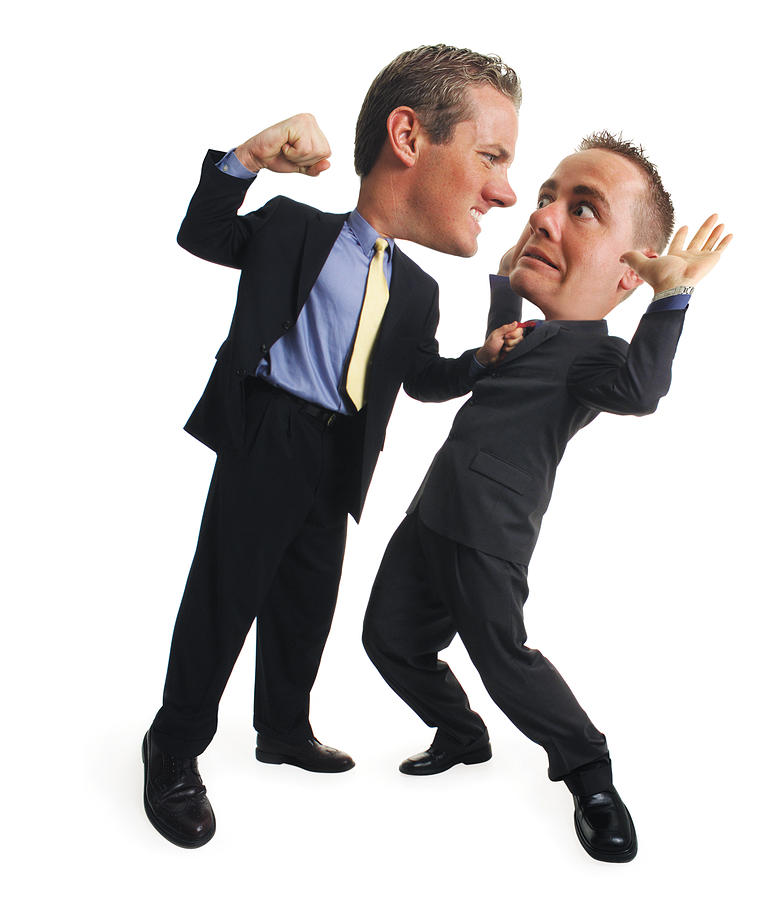 A Caucasian Business Man In A Blue Shirt And Dark Suit Grabs A Co-worker By His Collar And Reaches Back To Punch Him While The Co-worker Leans Back And Surrenders Photograph by Photodisc