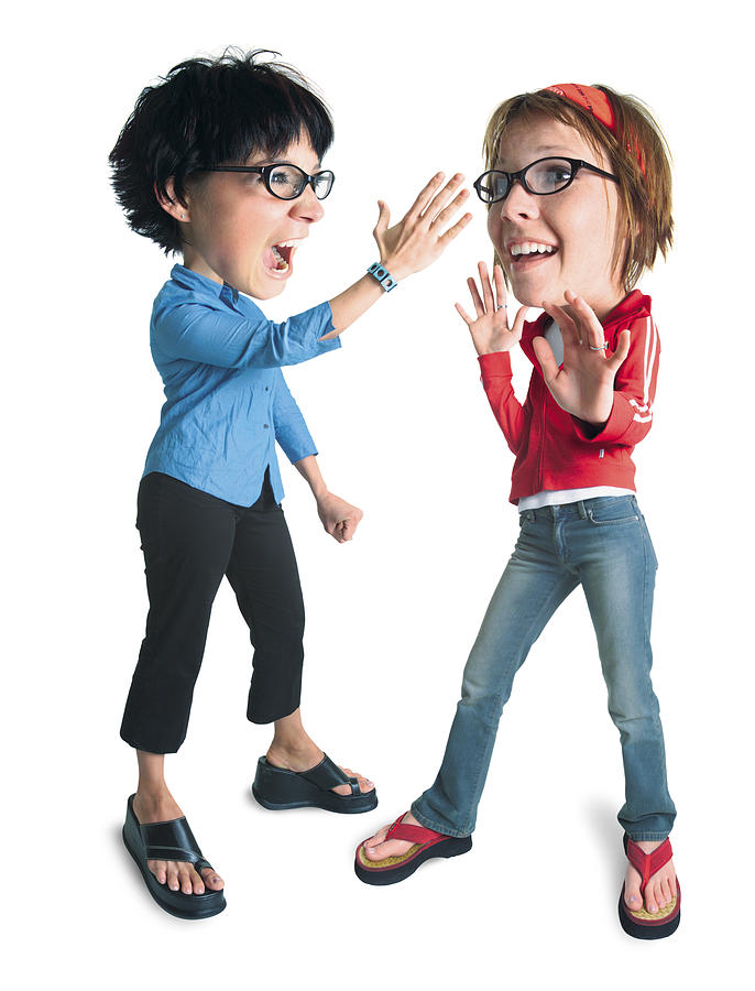 A Caucasian Female Wearing Black Horn Rimmed Glasses Defends Herself Against Another Caucasian Female Wearing Black Horn Rimmed Glasses Who Is About To Slap Her Photograph by Photodisc