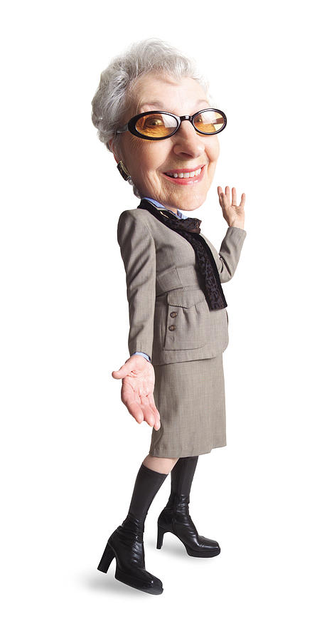 A Caucasian Grandma Wears Tinted Glasses And Knee High Boots And A Very Modern Looking Taupe Suit While Smiling At The Camera Photograph by Photodisc