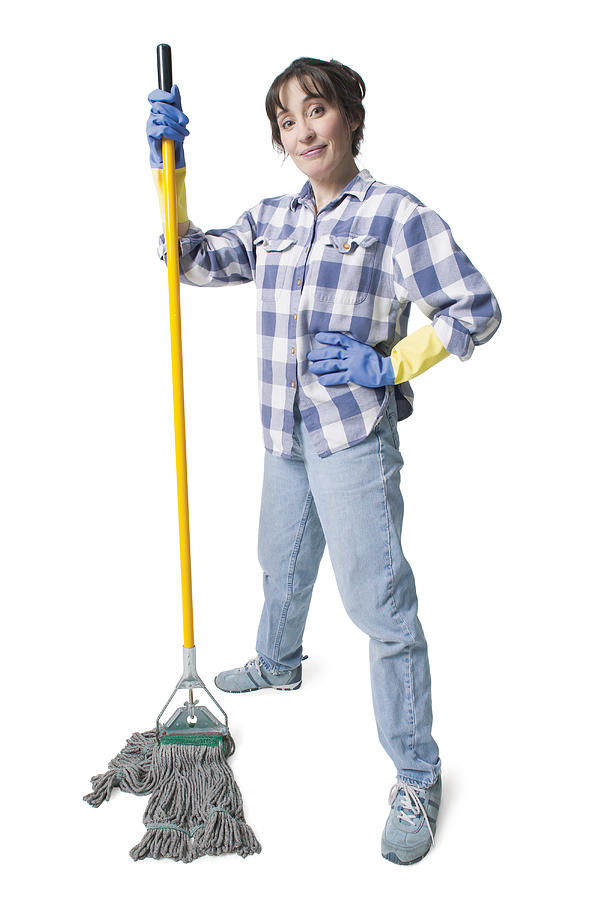 A Caucasian Woman In Jeans And A Plaid Shirt Wears Rubber Gloves And Holds A Mop Photograph by Photodisc