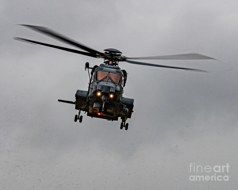 A Ch-148 Cyclone Moving Laterally Flashing The Beacon Photograph