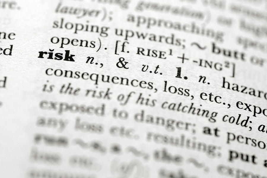 A close up focused on the definition of risk in a book Photograph by Trigga