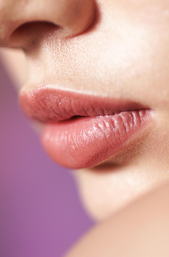 A Close Up Shot Of The Full Lips Of A Young Caucasian Girl Photograph by Digital Vision