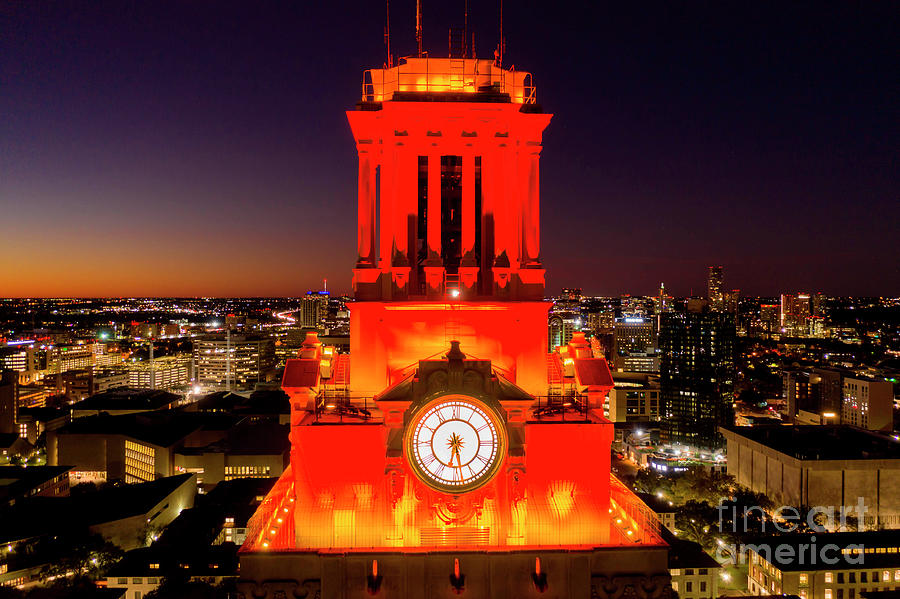 Sunset Photograph - A closeup birds eye aerial view of UT Clock Tower lit in burnt orange by Dan Herron