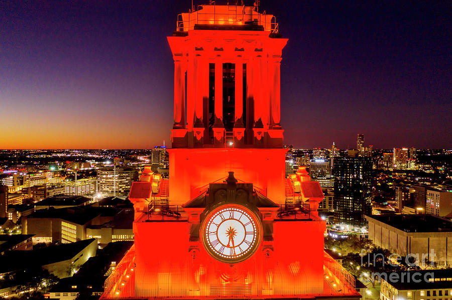 Sunset Photograph - A closeup view of the iconic UT Clock Tower shining bright over the University of Texas Campus by Dan Herron