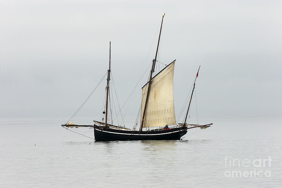 A Cornish Lugger becalmed in Mounts Bay, Cornwall. Photograph by Tony Mills