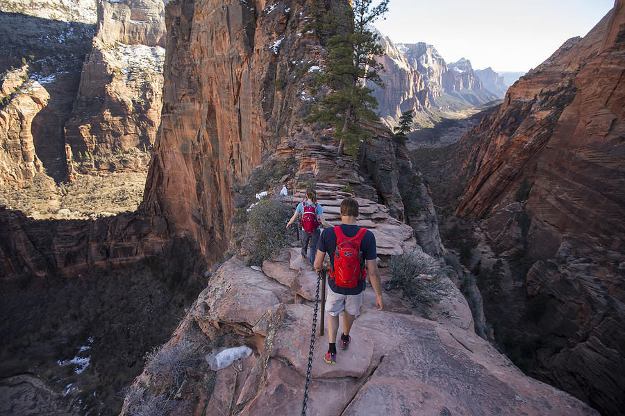 A couple hiking in Zion. Photograph by Jordan Siemens