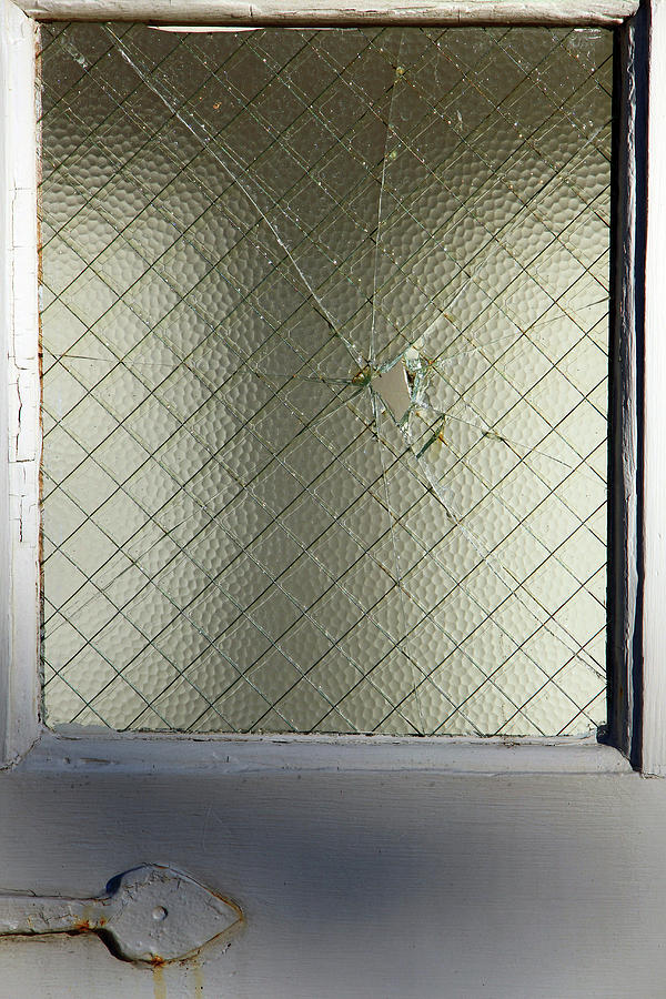 A Cracked Pane Of Glass Photograph