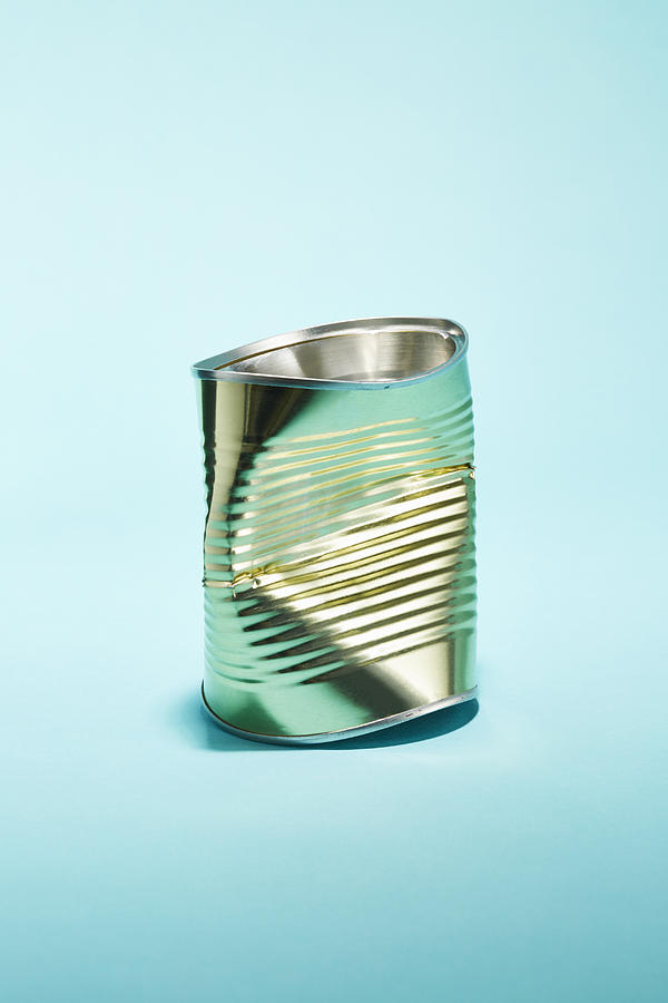 A crushed tin food can Photograph by Richard Drury
