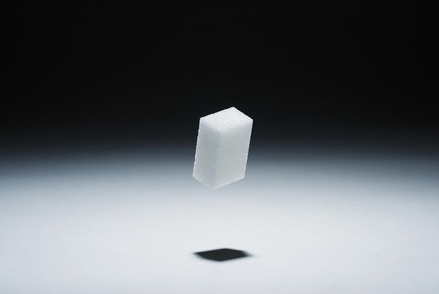 A cube of sugar in mid-air Photograph by Pep Karsten