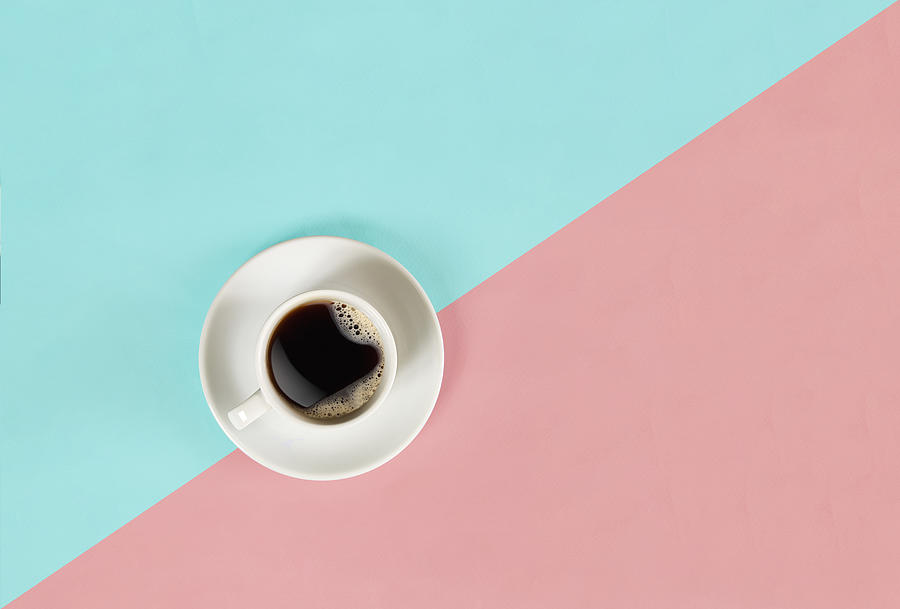 A cup of black coffee on blue and pink background. View from above Photograph by Sergey Nazarov