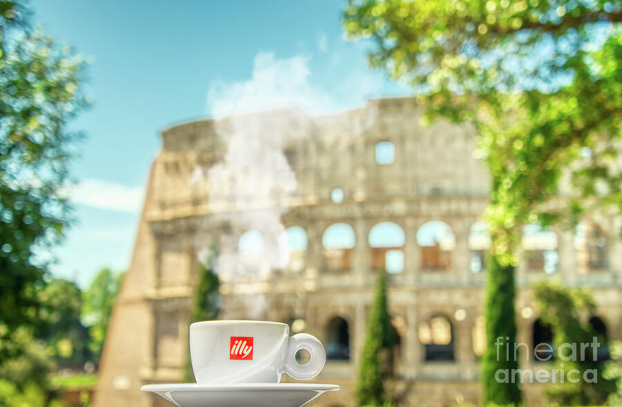 A cup of coffee in front of the panoramic view of Colosseo in Roma Photograph by Stefano Senise