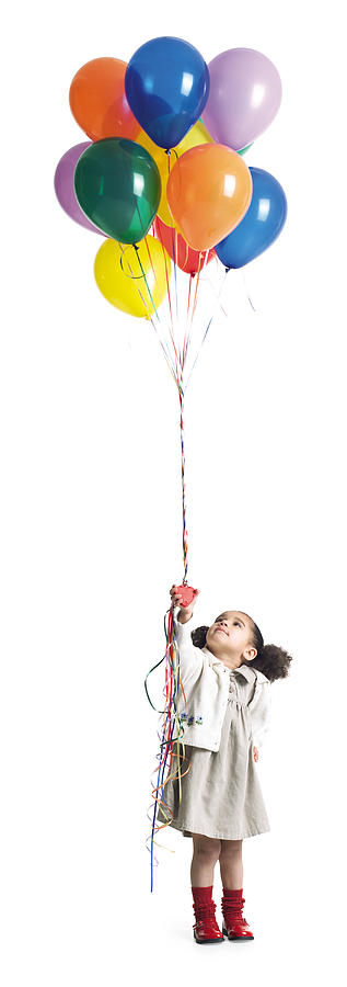 A Cute Little African American Girl Holds And Looks Up At A Bundle Of Balloons Photograph by Photodisc