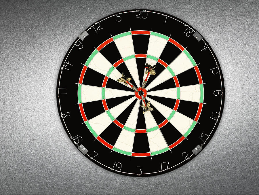 A dartboard with three darts in bullseye Photograph by Adam Gault