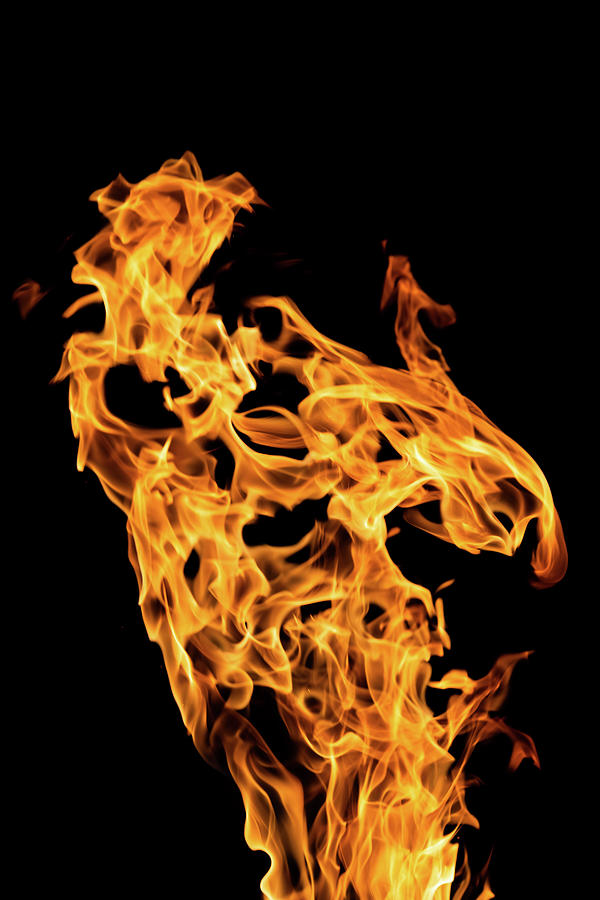 A detailed study of the glowing hot flames of a fire Photograph by Stan Weyler