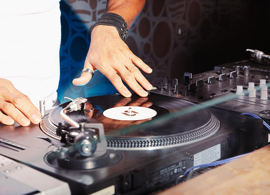 A DJ at a club Photograph by Paul Bradbury