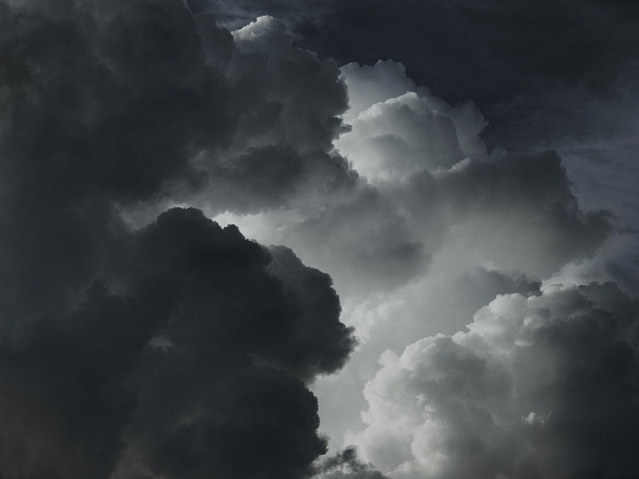 A dramatic cloudscape of black and white clouds Photograph by Pep Karsten