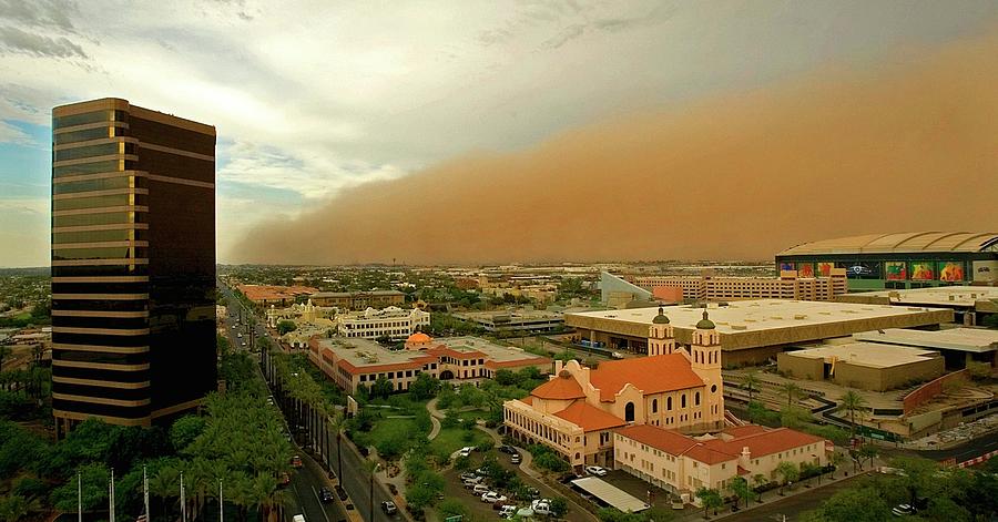 A Dust Storm Rolls Towards Downtown Phoenix Photograph by Rob Schumacher
