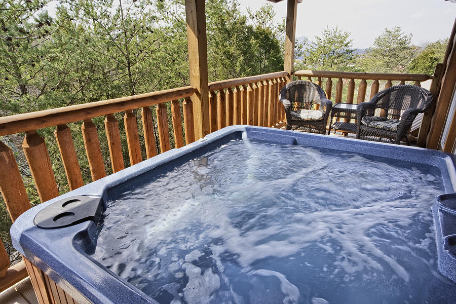 A empty running hot tub on the balcony Photograph by Wbritten