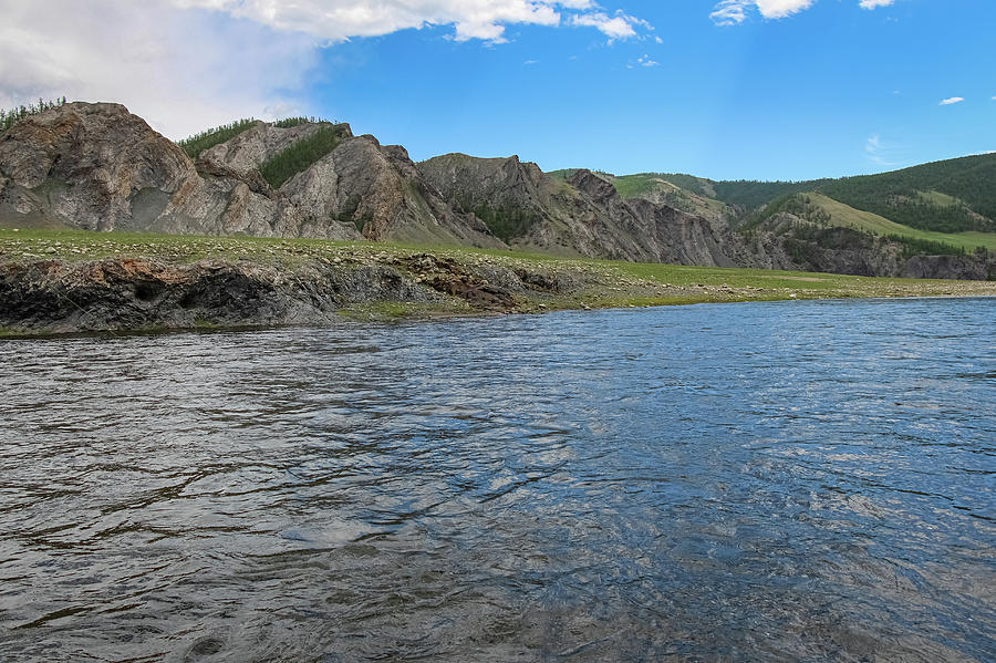 A fast river in Mongolia, with mountains and blue sky Photograph by ...