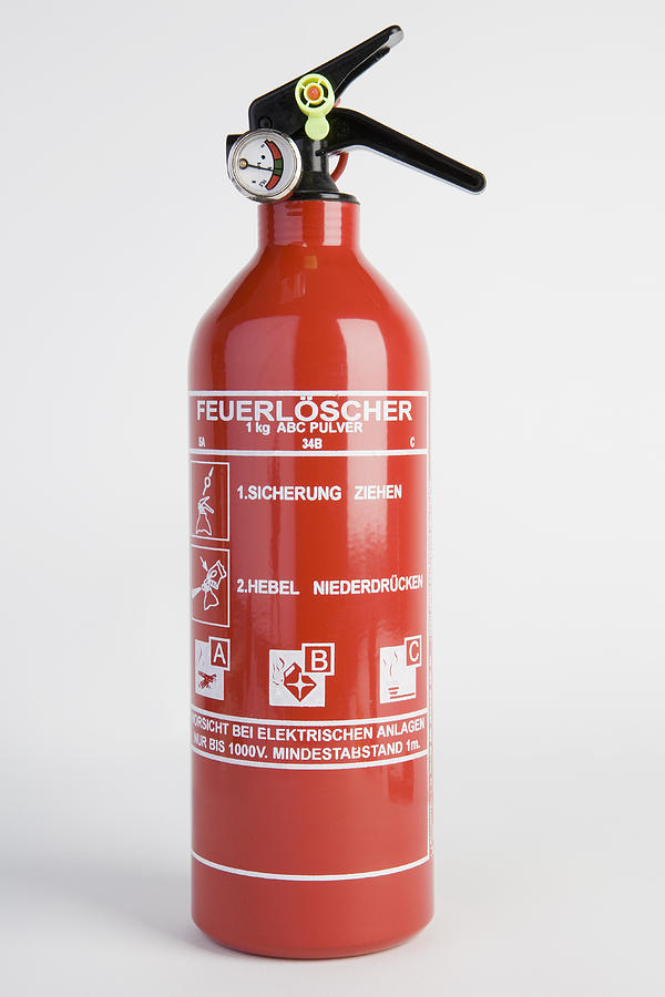 A fire extinguisher Photograph by Caspar Benson
