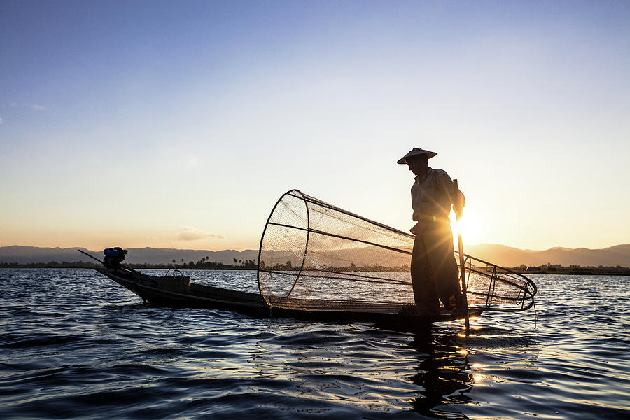 A fisherman in the sunset Photograph by Alfredo Garza - Pixels