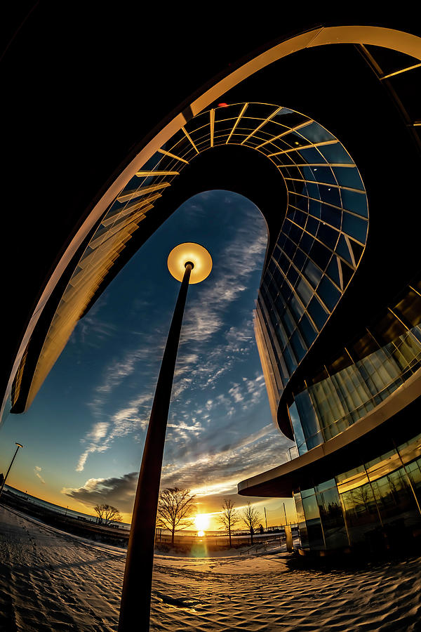 Northwestern University Photograph - A Fisheye view of a curvy modern building at sunrise by Sven Brogren