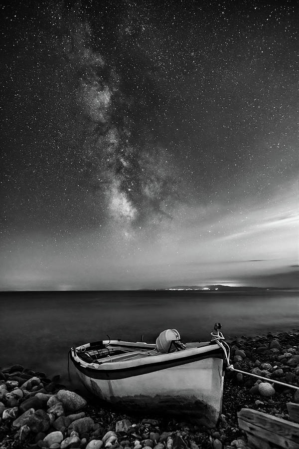 A Fishing Boat under the Milky Way in Black and White Photograph by Alexios Ntounas