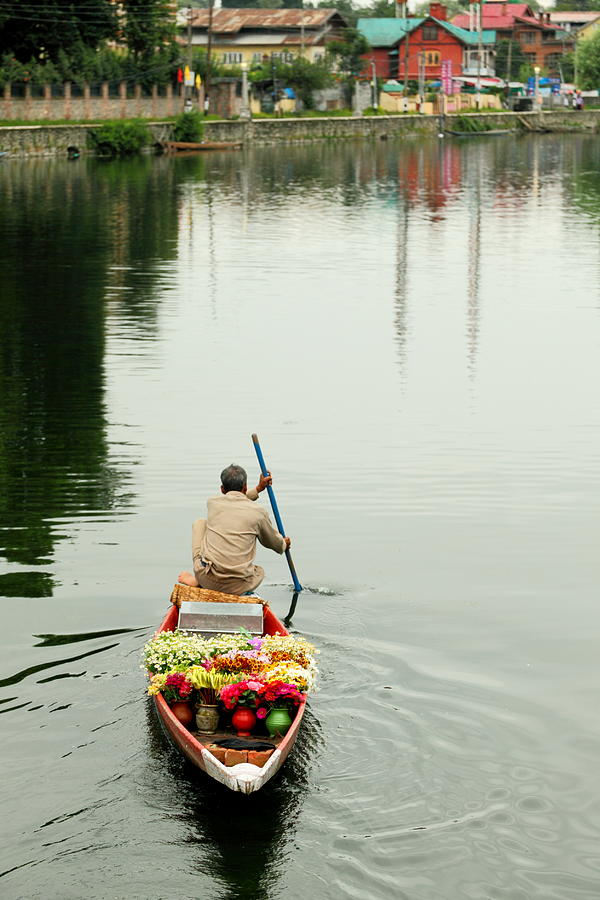 A flowerman in Dal lake Photograph by Rbb