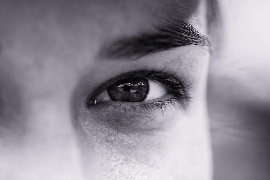 A focus shot of an eye of a man in black and white  Photograph by Hanis