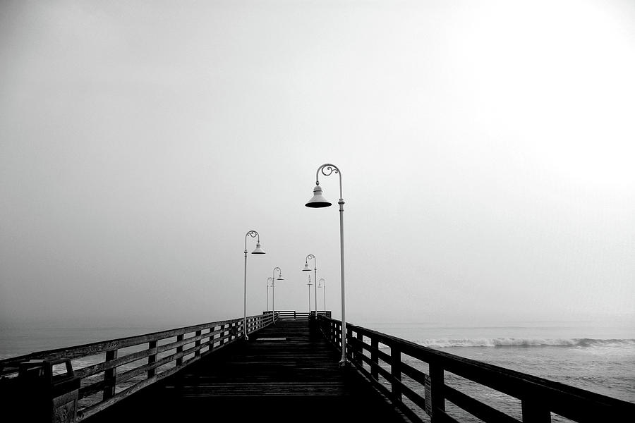 A Foggy Daytona Beach Fishing Pier In Black And White   Photograph by Christopher Mercer
