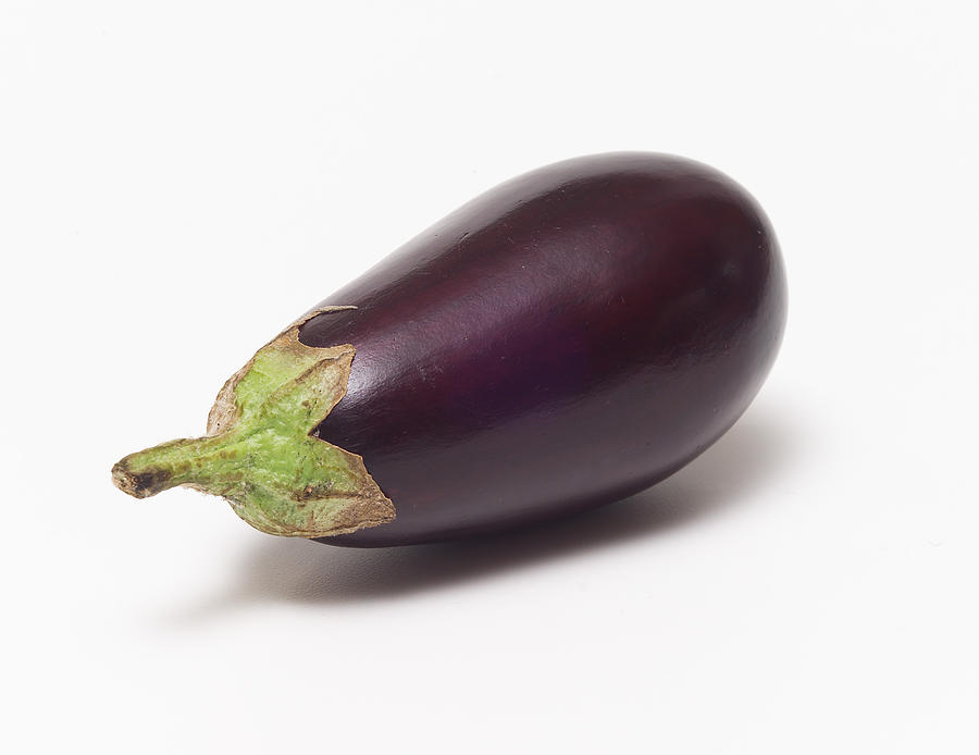 A fresh eggplant with a white background Photograph by Pjohnson1