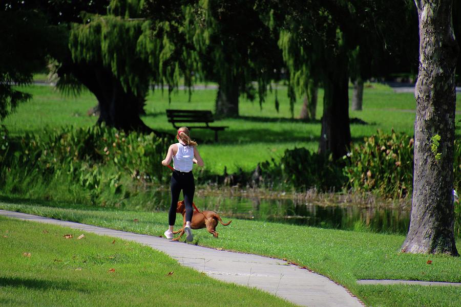A Fun Run In The Sun A Girl And Her Dog Photograph by Philip And Robbie Bracco