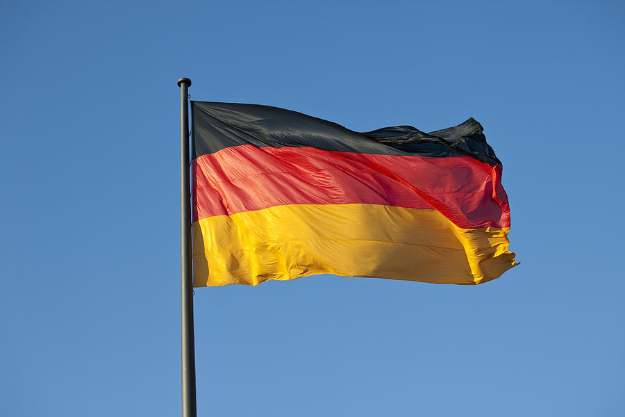 A German flag on a flag pole Photograph by Caspar Benson