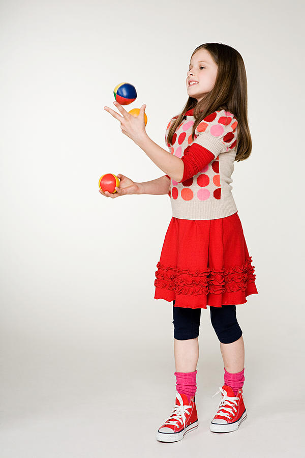 A girl juggling Photograph by Image Source