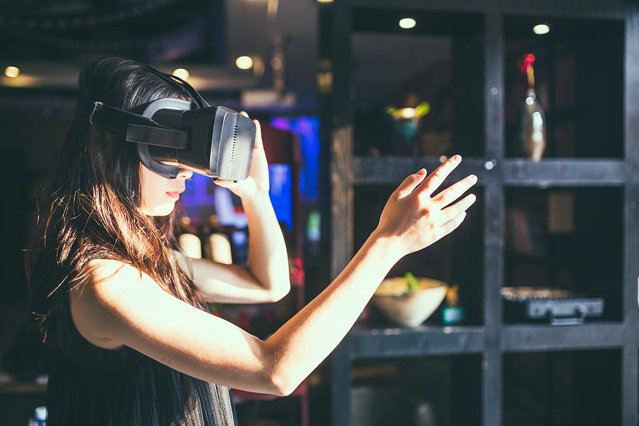 A girl with VR headset viewing 3D videos Photograph by Xvision